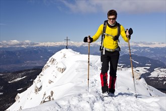 Winter hiker on the summit ridge of Jochgrimm
