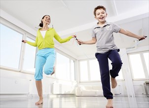 Mother and son skipping rope