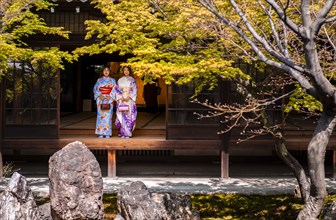 Two Japanese women dressed with kimono in the courtyard of O-shoin