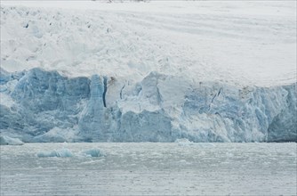 Ice avalanche into the water of a fjord