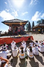 Hindu worshippers praying at Pura Ulun Danu Batur Temple