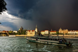 View over the Vltava river towards a thunderstorm