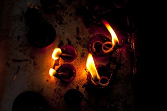 Burning oil lamps in an Indian temple