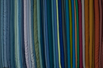 Fabrics lined up on a rack