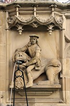 High relief of Samson with the Lion as a well figure on the Gothic Fischbrunnen fountain
