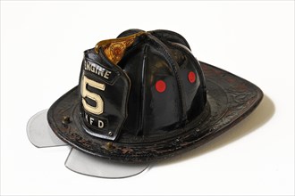 American fireman's helmet made of leather with a hinged eye shield