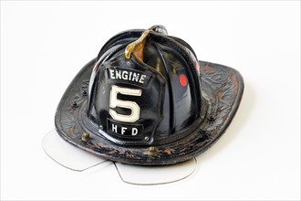 American fireman's helmet made of leather with a hinged eye shield