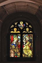 Tracery window with a holy scene