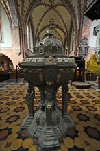 Renaissance baptismal font from 1592 in Guestrow Cathedral