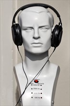 Mannequin's head with headphones