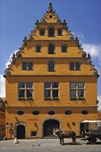 Former municipal granary with a steep pitched roof and Baroque voluted gable