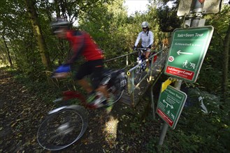 Cyclists riding electric bicycles