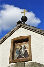 Painting or mural of a skeleton on the facade of a church