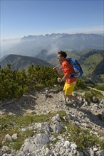 Hiker ascending Geigelstein Mountain