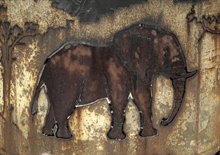 Handcrafted elephant illustration on a cauldron