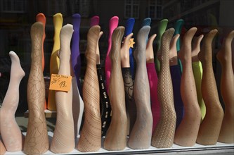 Display of mannekins' legs with stockings or tights in a shop window
