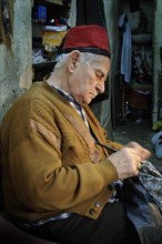 Arab craftsman working in the bazaar of Nazareth
