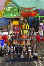 Stand selling gasoline in bottles