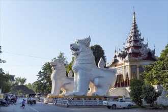 Huge statues of lions in front of the south entrance to Mandalay Hill