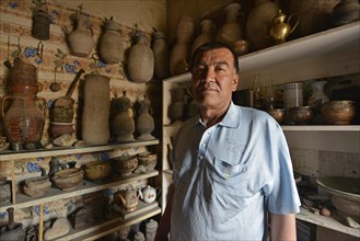 Kazakh antiques dealer in his antique shop