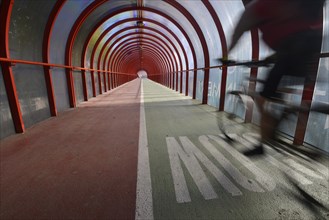 Cyclist is riding on Scottish Exhibition and Conference Centre Footbridge
