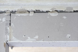Beams covered with plasterboard sheets
