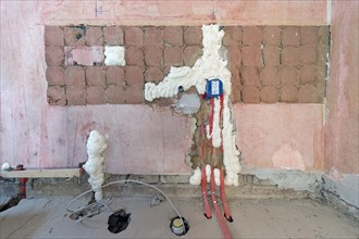 Wall cavities filled with foam insulation