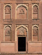 Decorative elements and niches carved in sandstone at the entrance to Bengali Mahal