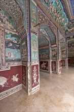 Wall paintings or frescoes painted with natural colours from the Bundikalam school of painting
