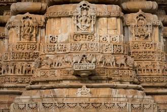 Decorative sculptures on the base of Kirti Stambha