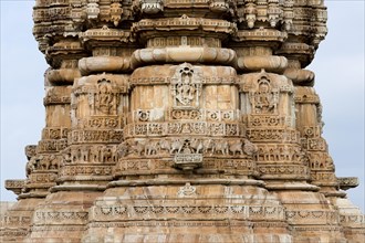 Decorative sculptures on the base of Kirti Stambha