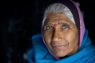 Mature woman with red bindi on her forehead