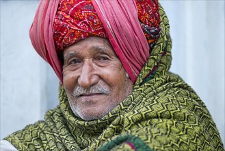 Elderly Indian man with a red turban