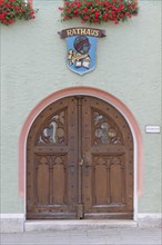 Entrance to City Hall of Pappenheim with the city coat of arms