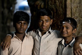 Three boys with bindi on their foreheads in Meenakshi Amman Temple or Sri Meenakshi Sundareswarar Temple