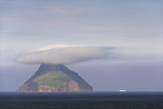The only uninhabited island of the Faroe Islands with a ferry of the Smyril Line travelling in the Suouroyarfjorour Strait