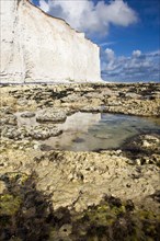 White chalk cliffs with reflections in the water