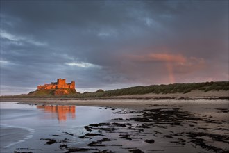 Bamburgh Castle with a rainbow after a storm