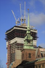 Tower of All Hallows by the Tower Church in front of the high-rise construction site of 20 Fenchurch Street