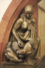 Bronze statue of a female farmer with cock and hen