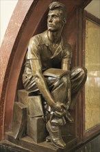 Bronze statue of a male student