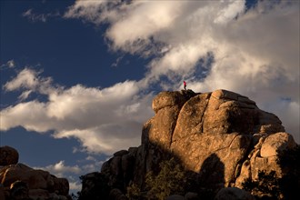 Climber on top of a rock