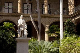Marble statue of Christopher Columbus in the courtyard of the Palacio de los Capitanes Generales