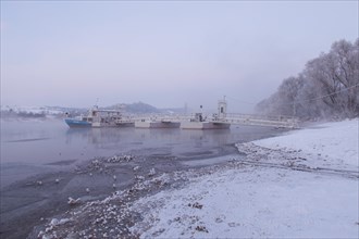 Ferry pier on a winter morning on the Elbe river