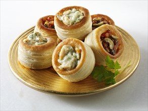 Vol-au-vents filled with salmon and dill cream and olive tapenade