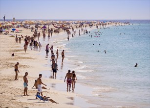 Tourists on the beach of Playa del Matorral