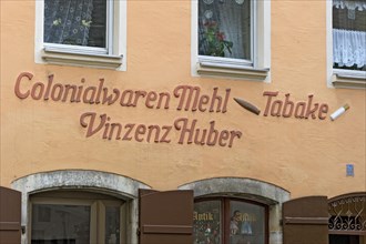 Stucco embossed lettering of a historic store