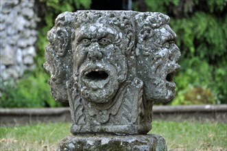 Stone mask with four heads at the grotto of the water source