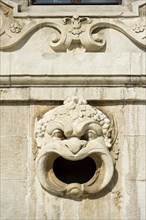 Decorative gargoyle on the outer wall of the Bavarian National Museum