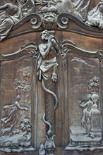 Carved relief image on the wooden portal